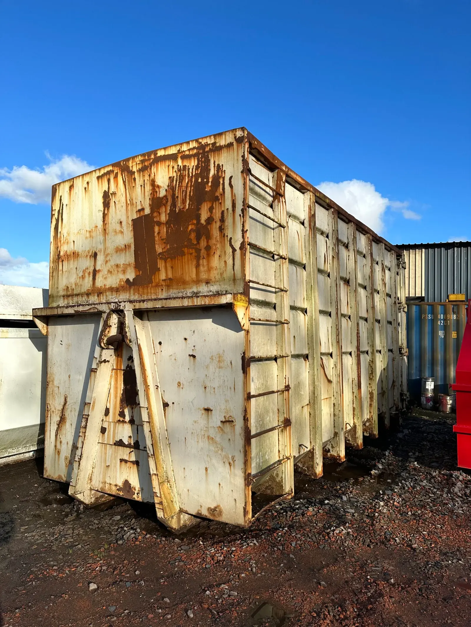 rusty roll on roll off skip ready to be refurbished
